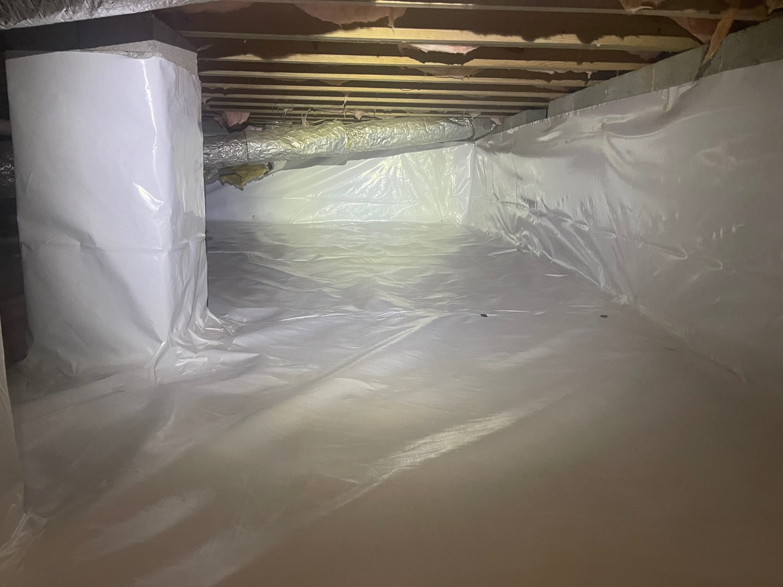 Finished crawl space encapsulation with vapor barrier walls and dehumidifier — completed by Crawl Daddy in Metro Atlanta