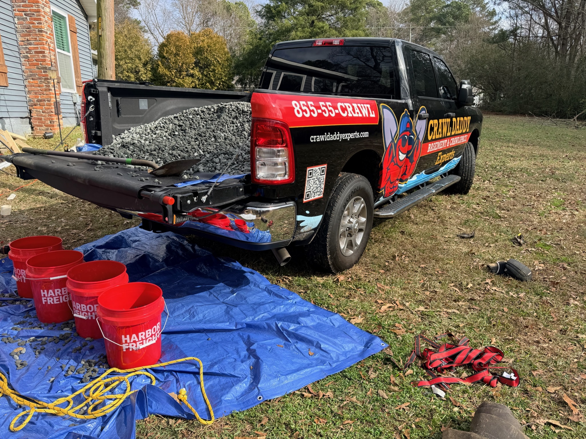 Crawl Daddy branded truck loaded with gravel at a Metro Atlanta jobsite